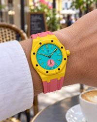Royal Pop Otg Roz on the wrist with its yellow and pink premium rubber strap