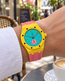 Royal Pop Otg Roz on the wrist with its yellow and pink premium rubber strap