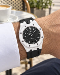 Royal Pop Ocho Negro on the wrist with its black and white premium rubber strap