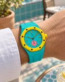 Royal Pop Otg Roz on the wrist with its turquoise premium rubber strap