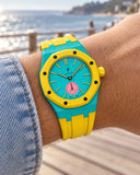 Royal Pop Otg Roz on the wrist with its turquoise and yellow premium rubber strap