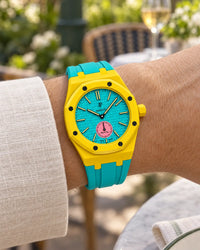 Royal Pop Otg Roz on the wrist with its yellow and turquoise premium rubber strap