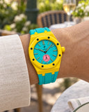 Royal Pop Otg Roz on the wrist with its yellow and turquoise premium rubber strap