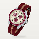 Burgundy and tan striped nylon strap for Omega x Swatch MoonSwatch Mission to Pluto, fitted on the watch