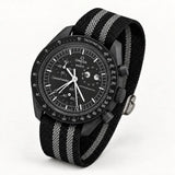 Black fabric strap with two grey stripes on MoonSwatch Moonphase New Moon