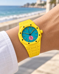 Yellow ceramic strap for the AP x Swatch Royal Pop Otg Roz worn on the wrist | WatchCollab