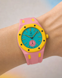 Two-tone strap for the AP x Swatch Royal Pop Otg Roz worn on the wrist | WatchCollab