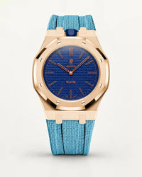 Cinturino effetto tessuto azzurro per AP x Swatch Royal Pop Orenji Hachi, cassa oro rosa (corona a ore 12)