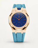 Cinturino effetto tessuto azzurro per AP x Swatch Royal Pop Orenji Hachi, cassa oro rosa (corona a ore 12)