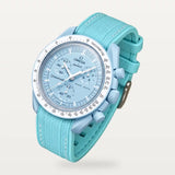 Cyan premium rubber strap with white stitching on MoonSwatch Mission to Uranus