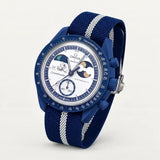 Navy blue premium canvas strap with white stripes on MoonSwatch Earthphase Moonshine Gold