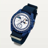 Navy blue NATO strap on MoonSwatch Earthphase Moonshine Gold