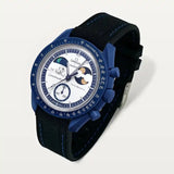 Black premium rubber strap with blue stitching on MoonSwatch Earthphase Moonshine Gold