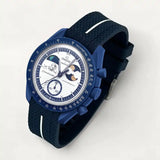 Navy blue premium rubber strap with white contrast band on MoonSwatch Earthphase Moonshine Gold