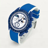 Blue and white two-tone premium rubber strap on MoonSwatch Earthphase Moonshine Gold