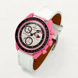 White textured leather strap on MoonSwatch Pink Moonphase