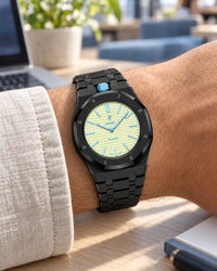 Black steel strap worn on the wrist with the AP x Swatch Royal Pop Blaue Acht
