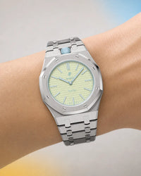 Royal Pop Blaue Acht worn on the wrist with the WatchCollab silver steel integrated bracelet