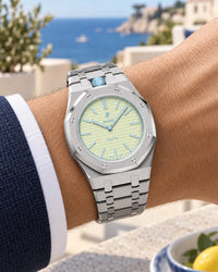 Royal Pop Blaue Acht worn on the wrist with the WatchCollab silver steel integrated bracelet