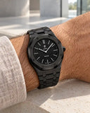 Black steel strap worn on the wrist with the AP x Swatch Royal Pop Ocho Negro