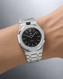 Royal Pop Ocho Negro worn on the wrist with the WatchCollab silver steel integrated bracelet