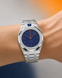 Royal Pop Orenji Hachi worn on the wrist with the WatchCollab silver steel integrated bracelet