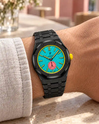 Black steel strap worn on the wrist with the AP x Swatch Royal Pop Otg Roz
