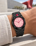 Black steel strap worn on the wrist with the AP x Swatch Royal Pop Otto Rosso